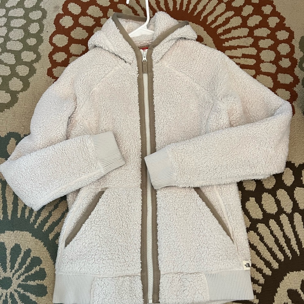 The North Face Fleece, size M, fuzzy/furry, beige color with tan trim.